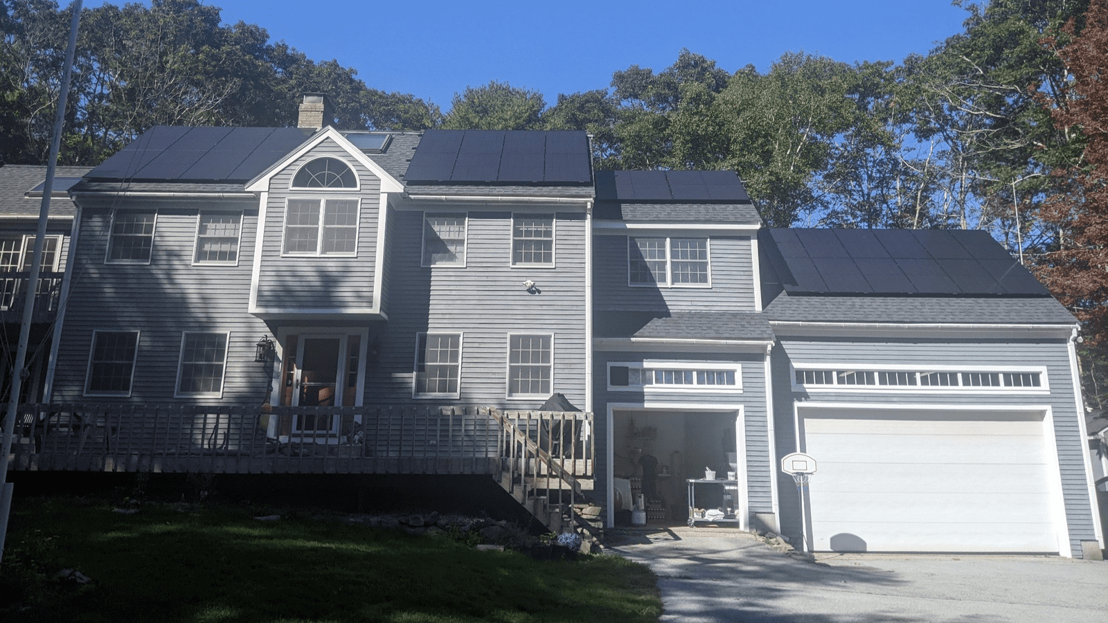 gray house with solar panel on roof